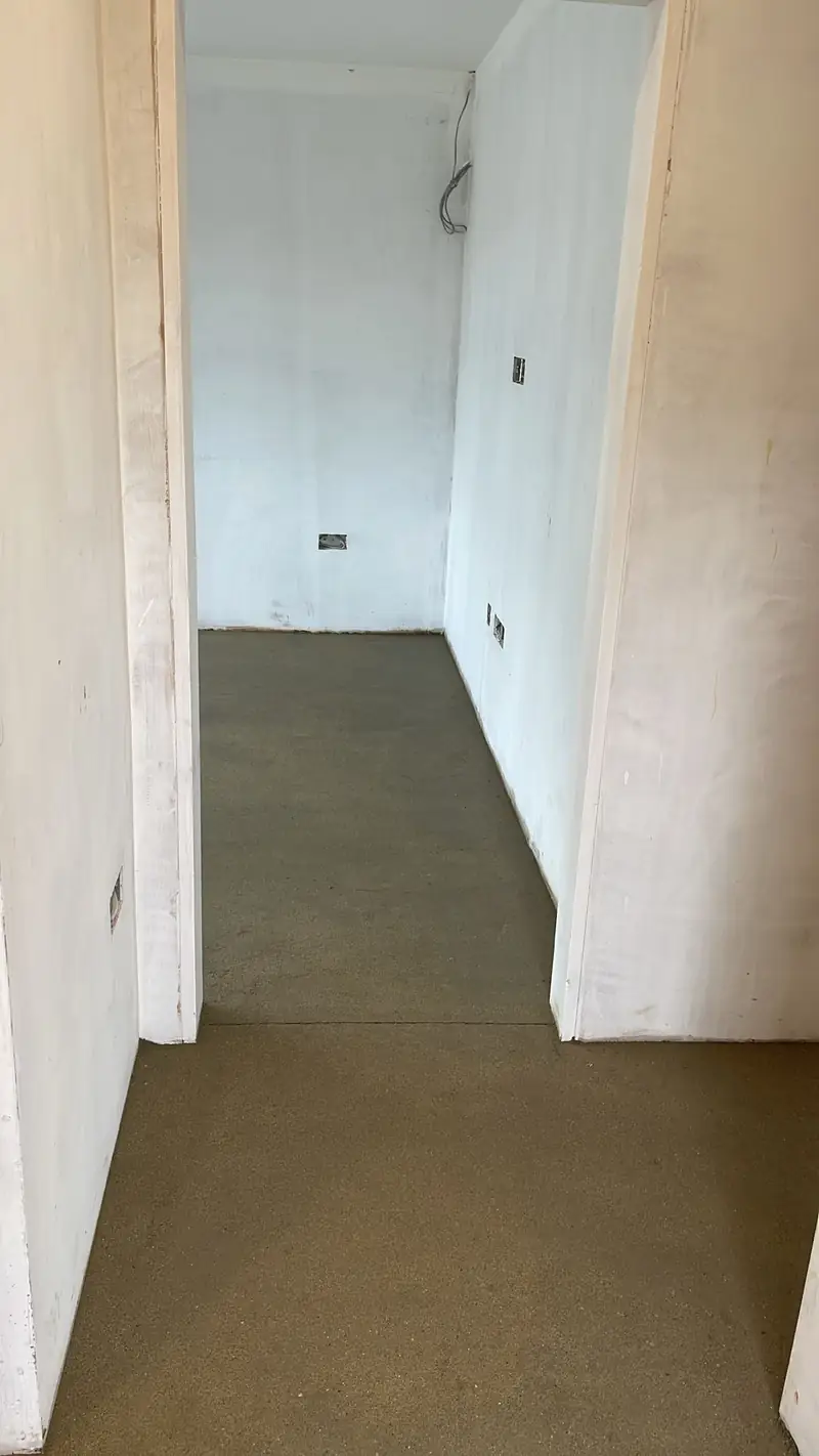Screeded hallway in a newly plastered house