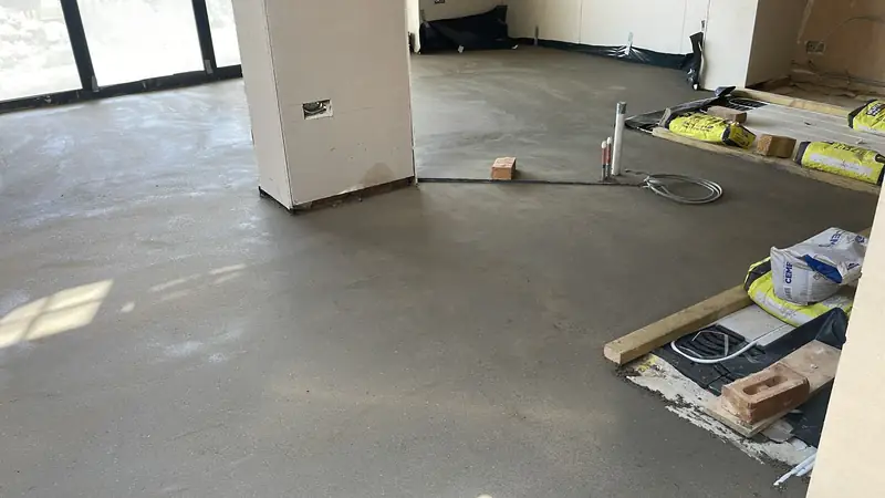 Open-plan extension with a completed screed floor and bi-fold door opening