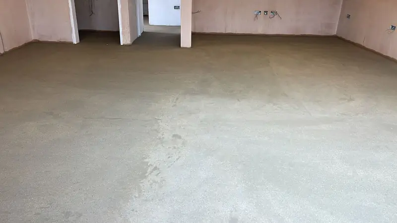 Plastered room with a completed screed ready for the next trade