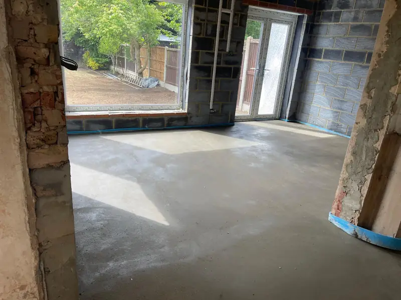 Finished screed around a new steel post where a rear wall has been opened up