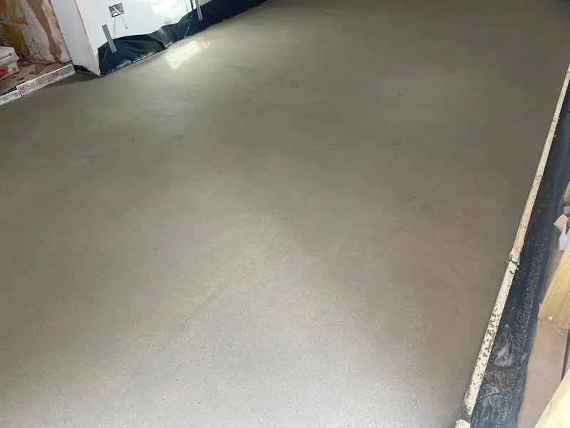 Wide view of a large extension with an even sand and cement screed